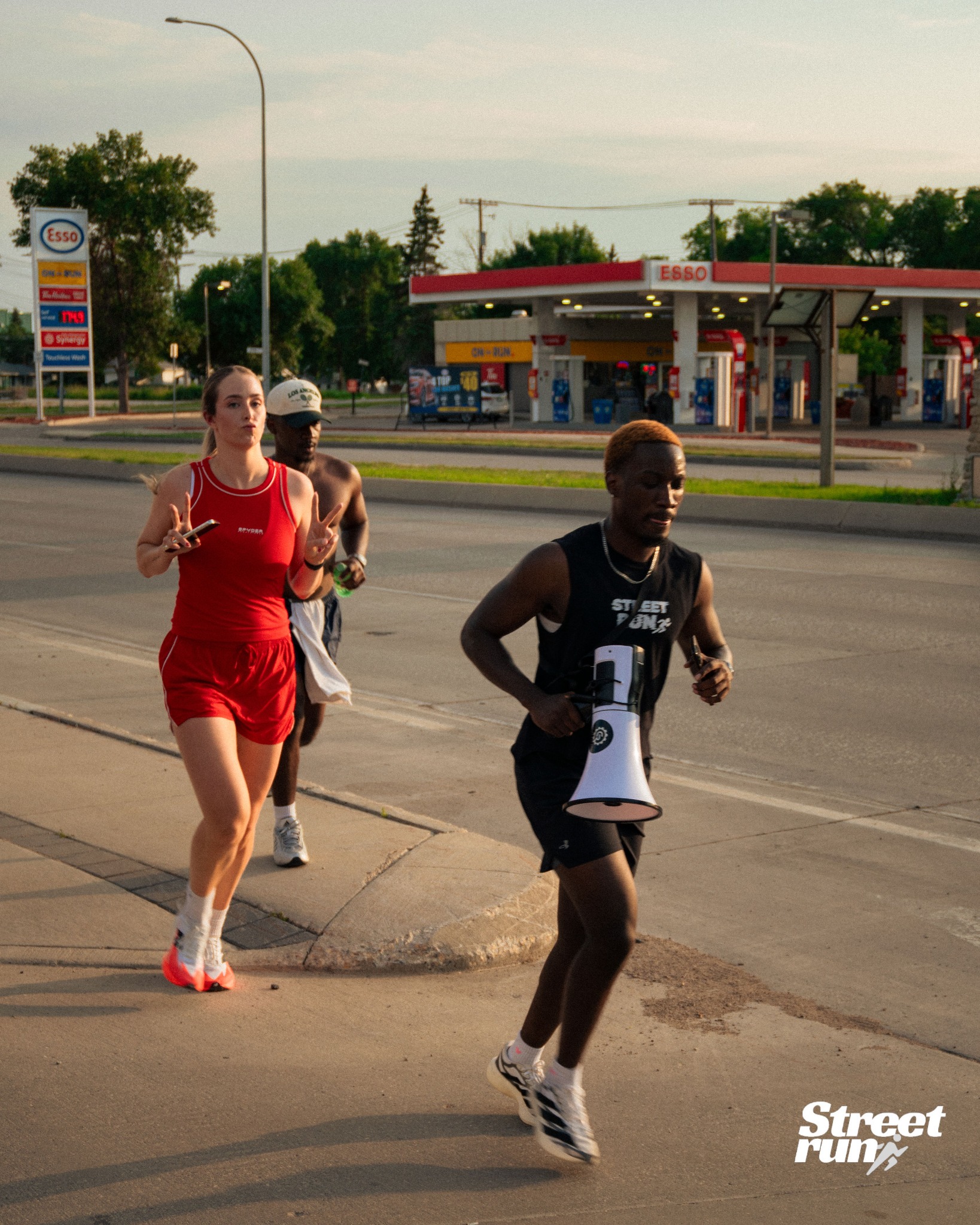 Street Run Club leader running with a megaphone
